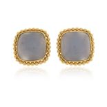 A pair of blue chalcedony cabochon earrings, set within yellow gold pellet borders, 1.9cm wide,