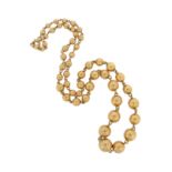 A yellow gold bead necklace, the spherical gold beads graduate from 3.9 - 9.7mm, 46cm long, 23g