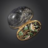 A mid 18th century carved labradorite scarab-form snuff box, the hinged blue glass cover decorated