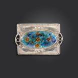 An Arts & Crafts silver and polychrome enamel brooch, of rectangular form with an oval enamel floral