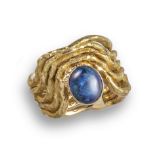 ‡ An opal-set gold ring by Andrew Grima, of undulating openwork design, set in textured gold with a