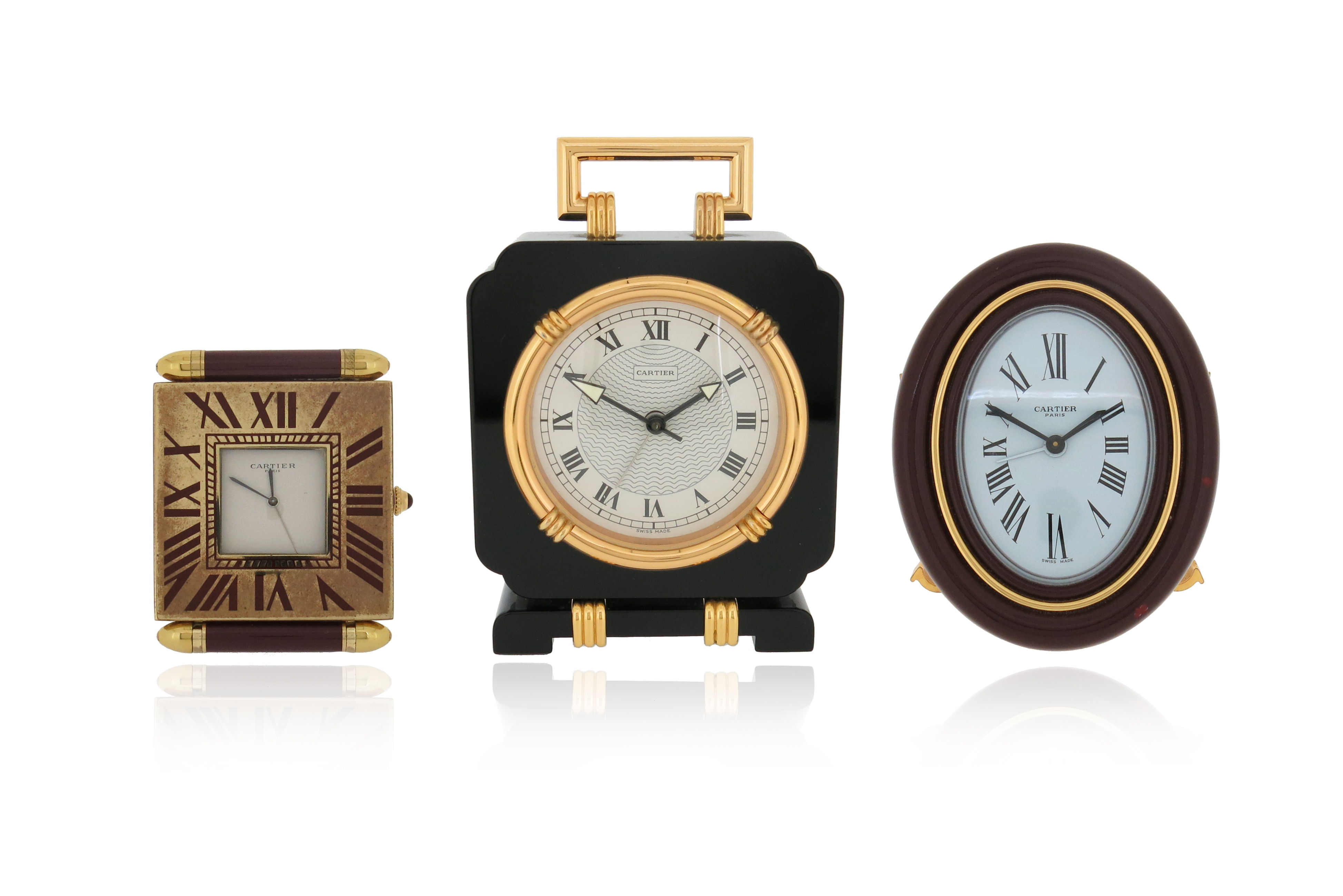 Three travel clocks by Cartier, including a Must de Cartier brass and red enamel travel alarm clock, - Image 3 of 9