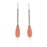 λ A pair of coral and diamond drop earrings, the coral drops suspend from articulated round