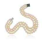 A three-row cultured pearl necklace, with an emerald and diamond quatrefoil clasp, set in white