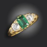 A Victorian emerald and diamond half-hoop ring, set with an emerald-cut emerald, two old circular-