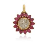 A ruby and diamond sunflower pendant, with a diamond-set heart-shaped centre and cabochon ruby