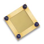 A yellow gold square frame by Boucheron, mounted with four lapis lazuli beads, with hinged gold