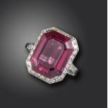 An Art Deco tourmaline and diamond ring, the emerald-cut pink tourmaline set within single-cut