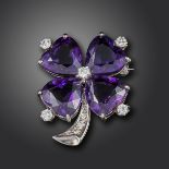 An amethyst and diamond-set shamrock brooch, set with heart-shaped amethysts and circular-cut