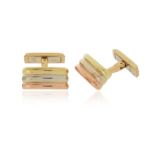 A pair of fluted gold cufflinks by Cartier, in three-colour gold, signed and dated 1999, 18mm high