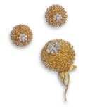 A diamond flower brooch and earring suite by Hammerman Brothers, c1960, with ropetwist petals,