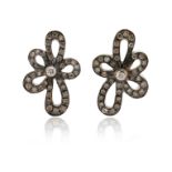 A pair of diamond flowerhead earrings, set in white gold, 2cm long, post fittings