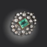 A Victorian emerald and diamond brooch, the rectangular-shaped emerald set within a surround of