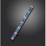 An early 20th century sapphire and diamond bar brooch, set with pairs of French-cut sapphires and