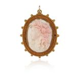 A 19th century shell cameo brooch pendant, depicting Flora in profile within gold Etruscan Revival