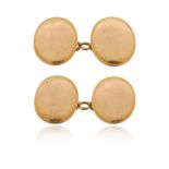 A pair of gold cufflinks, the plain oval discs in 15ct gold, 17mm high