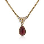 A ruby and diamond necklace, set with round brilliant-cut diamonds, suspending a cabochon ruby in