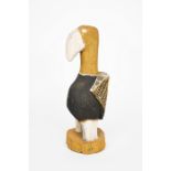 An Aborignal model of a bird Tiwi Islands, Australia wood with yellow, black and white pigment, 46.