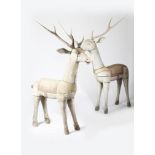 A pair of large carved wood deer, carved and painted blanket saddle and painted decoration and