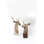 A pair of tall carved wood deer heads, with carved and painted decoration and real antlers, 154cm.