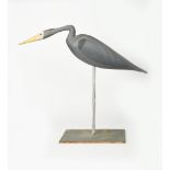 A large American carved wood decoy model of a Grey Heron by J P Hand, painted in colours, on