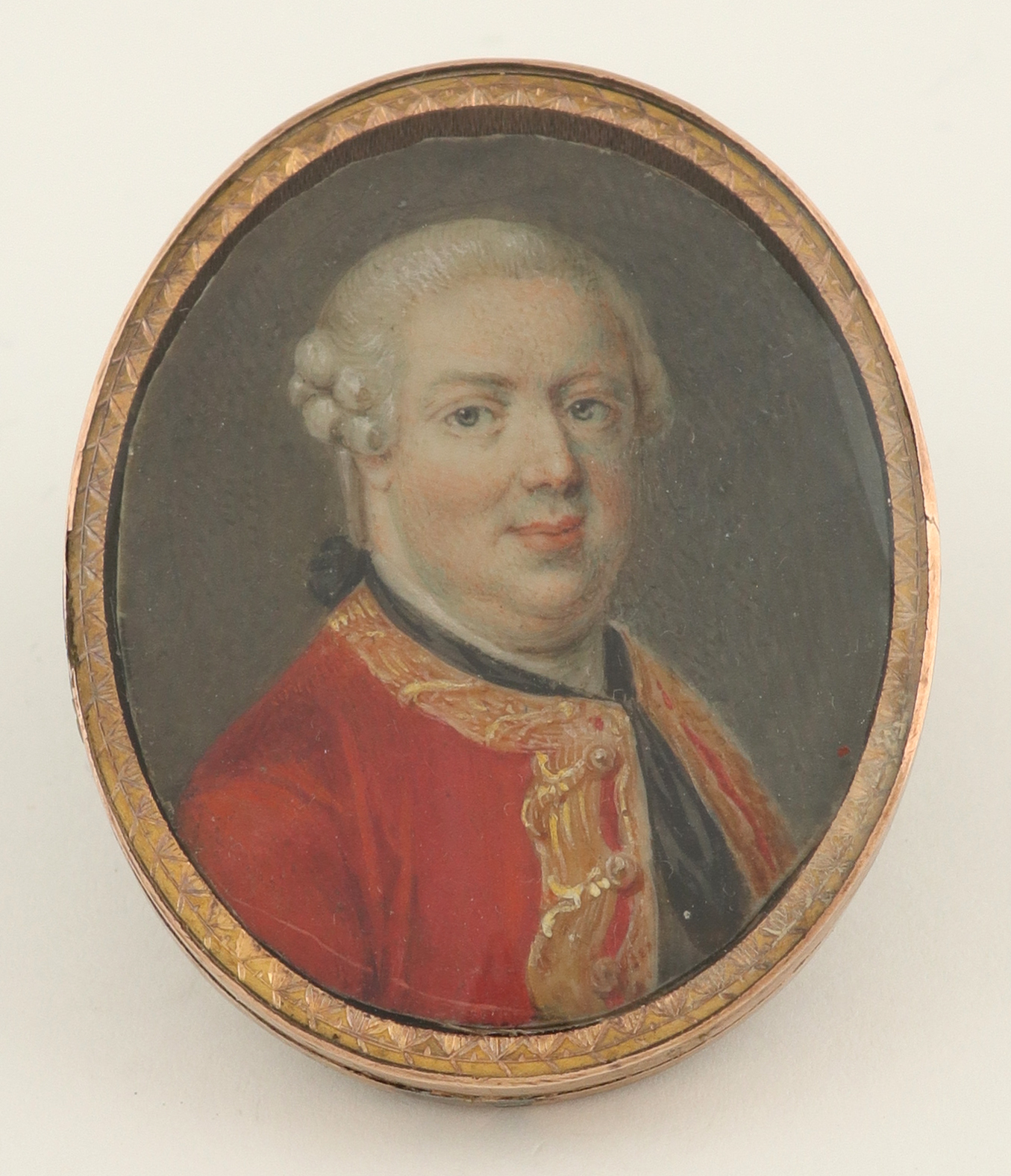 λEnglish School Late 18th Century Portrait miniature of a gentleman, in a red coat and black stock