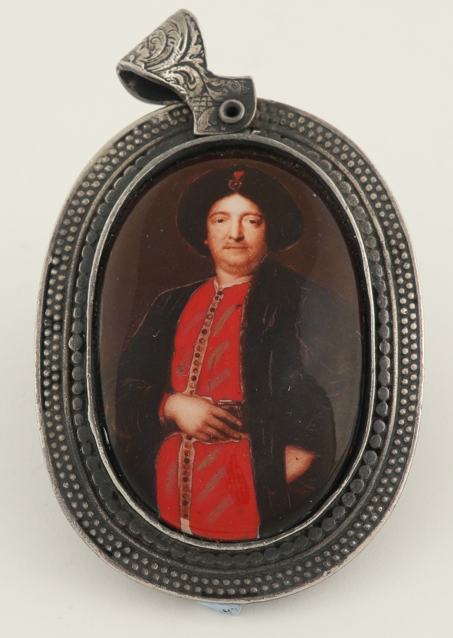 Continental School 20th Century Portrait miniature of a gentleman, in oriental dress Oval, enamel