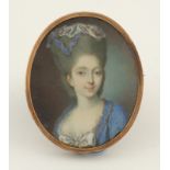 λFrench School 18th Century Portrait miniature of a young lady, wearing a blue dress, and lace cap