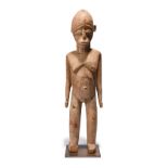 A Lobi standing male figure bateba Burkina Faso 40.5cm high, on a base. (2) Provenance Donald Tait