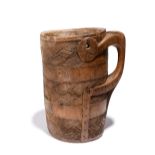 A Tibet milk pot with a zoomorphic handle and three bands of interlaced linear decoration, 27cm