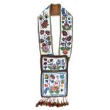 An Ojibwa bandolier bag Canada cloth, military braid, velveteen, wool and coloured glass beads, with