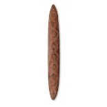 An Aboriginal bullroarer Australia with carved linear and concentric circle decoration, with