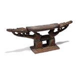 A Papua New Guinea headrest North Coast the carved rectangular base with a pair of arched supports