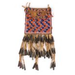 An Apache beaded front pouch Southwest North America buckskin, coloured glass beads and tin cones,