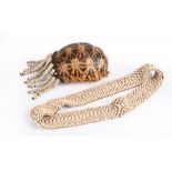 λA San bushman container South Africa tortoiseshell, leather and ostrich egg shell beads, 15.5cm