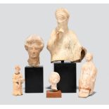 Five Hellenistic female heads and figures circa 3rd - 2nd century BC including two seated figures,