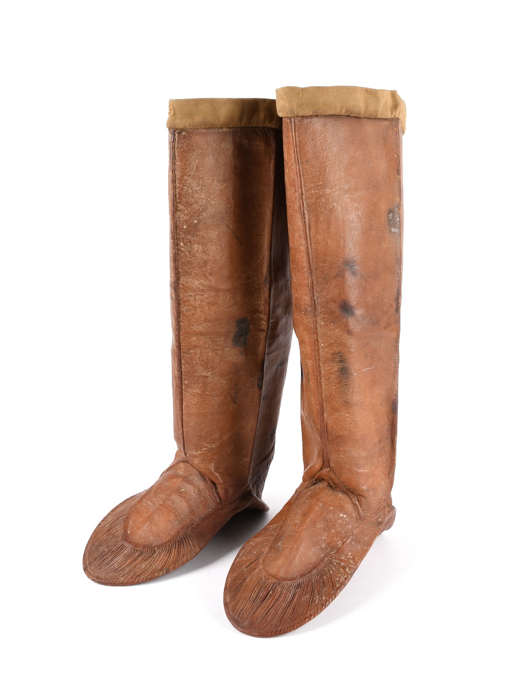 A pair of Inuit boots Labrador, circa 1880 sealskin, pleated heels and front, with cloth rims,