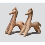 A pair of Cypriot bichrome ware models of horses circa 7th - 6th century BC with red and black