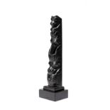 A Haida totem pole Northwest Coast argillite with a whale, a raven and a bear, 24.5cm high, with a