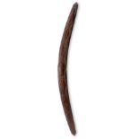 An Aboriginal boomerang Eastern Australia with pointed ends and carved wavy linear and zig-zag