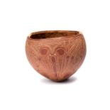 A Papua New Guinea bowl / cup Melanesia coconut shell with carved curvilinear decoration, 9.5cm