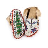 A pair of Western Sioux fully beaded moccasins Plains buckskin and coloured glass and cut brass