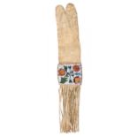 An Ojibwa pipe bag Northeast North America buckskin, coloured glass beads and dyed quill, the four