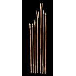 λA collection of seven Inuit arrows Alaska painted wood with differing marine ivory tips, five