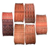 Six Sumba ikat hinggi cloths Indonesia depicting mythical beasts, horses, birds, skeletons, lizards,