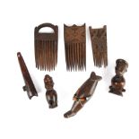 Three Chokwe combs Angola with carved geometric decoration, one with a demi-lune handle, 13.5cm,