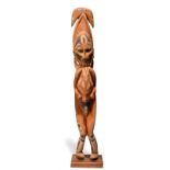 An Abelam male ancestor figure Maprik River, Papua New Guinea with birds to the backs of the