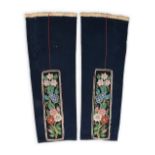 A pair of Cree leggings Subarctic dark blue cloth with red cloth piping and a printed cotton