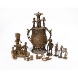 An Akan kuduo Ghana brass with figures to the cover and handles, 21.5cm high, an Akan brass