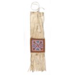 A Stoney or Plains Cree pipe bag Canadian Plains buckskin, cloth and coloured glass beads with